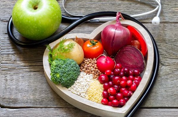 A heart-shaped box with greens