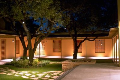 walled in courtyard that centers a a strand of trees