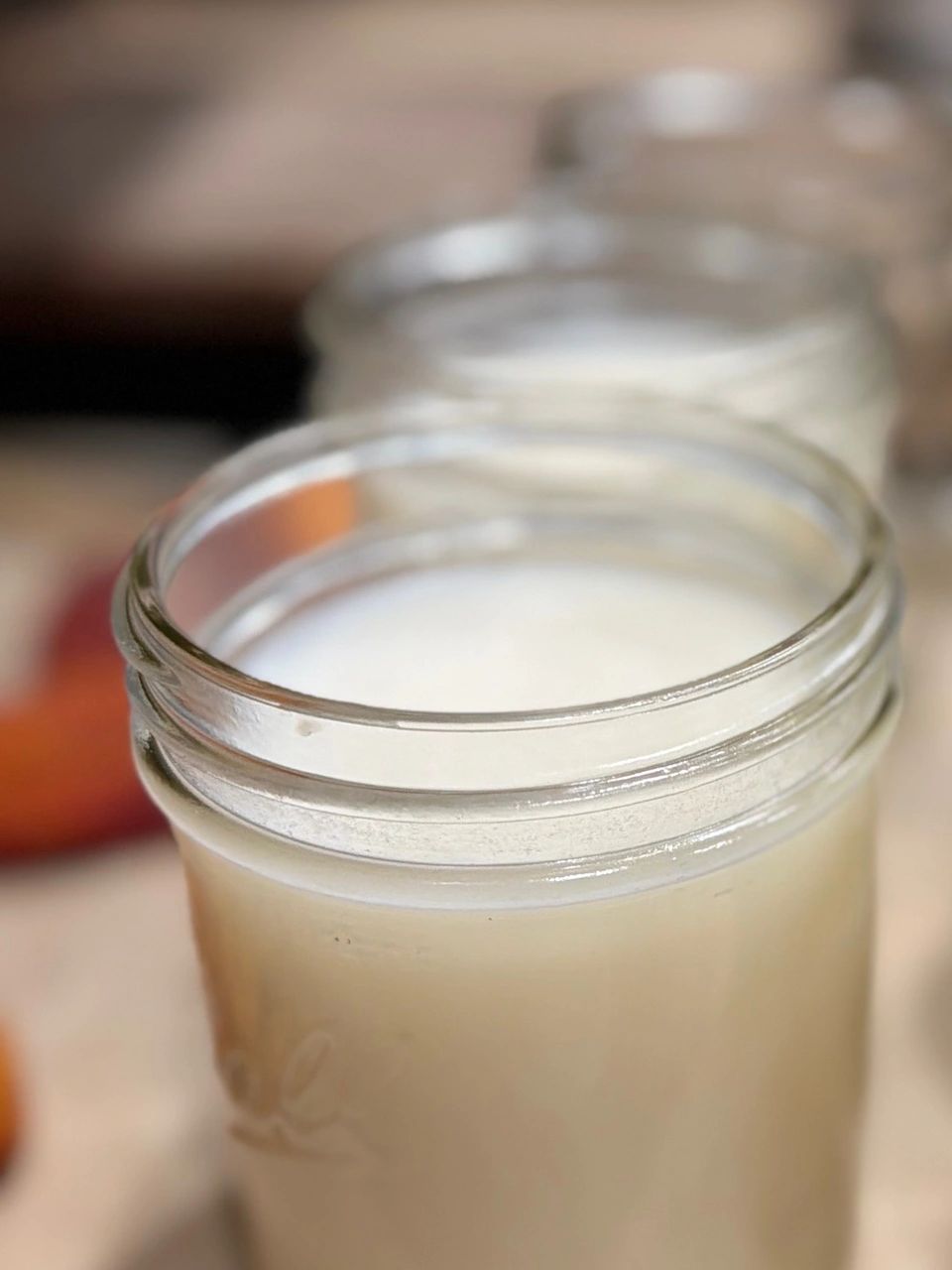 Close-up of a glass jar filled with milk.