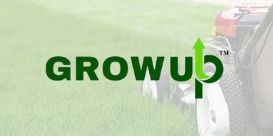 "Grow Up" logo with grass and lawnmower in background