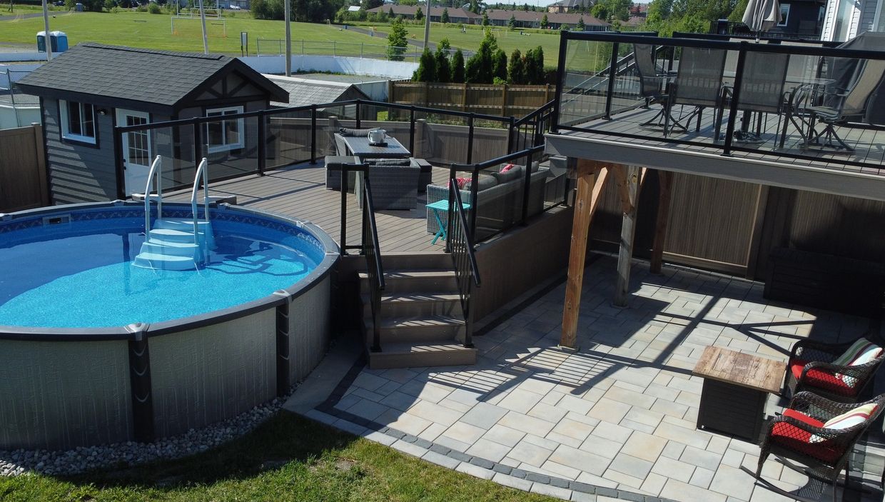 Backyard transformation exterior renovation pool deck composite patio shed custom yard vinyl fence