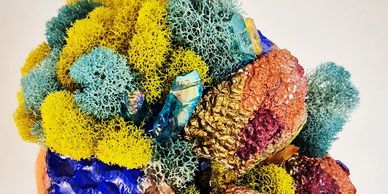 Colorful preserved moss and natural textures artfully arranged.