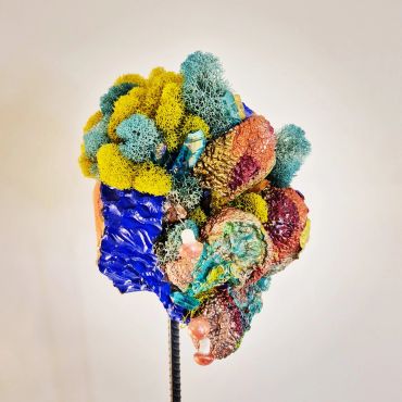 Colorful abstract sculpture with vibrant textures and organic shapes.