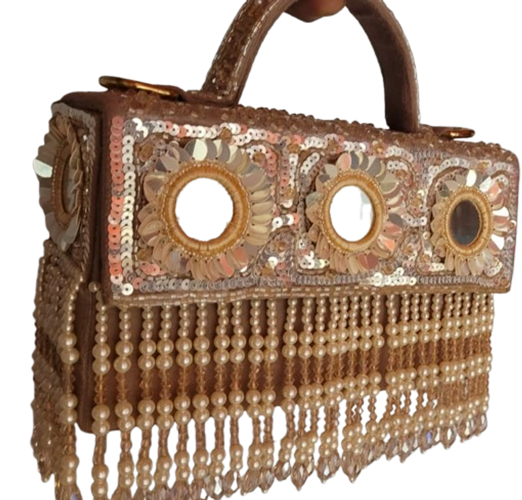 Handcrafted ethnic bridal clutch bag with premium gold sequin embellishments and mirror work. ₹2900.