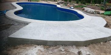 Concrete pool surround. Stamped concrete.