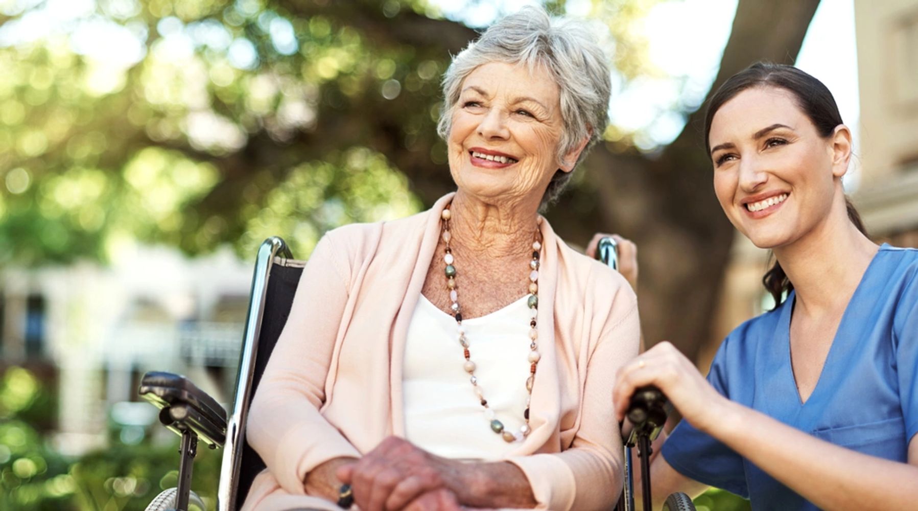 Shot of a Young Nurse Spending Time With a Senior Woman in a Wheelchair in the Garden