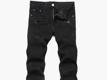 Black textured biker-style jeans with zippered pockets.