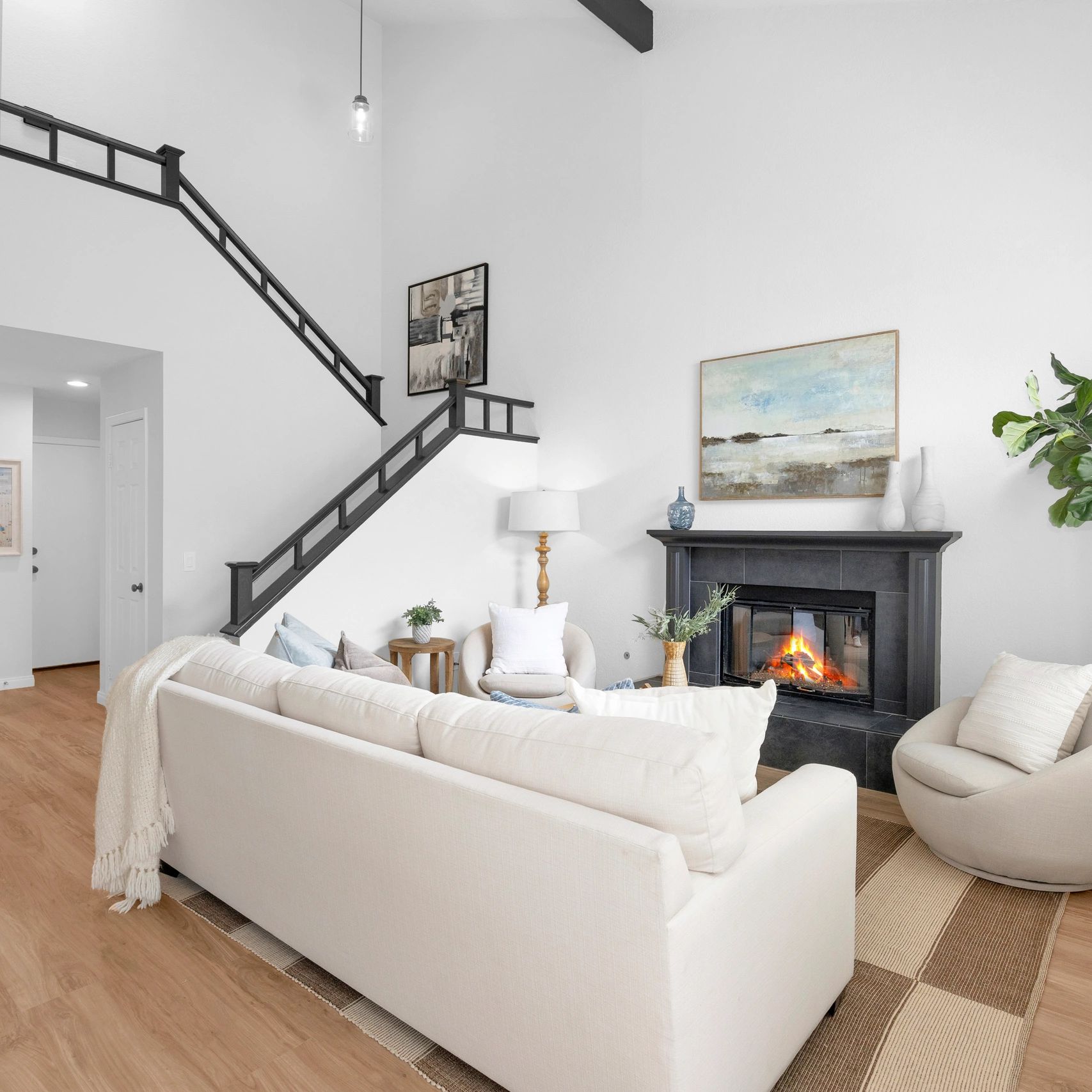 Cozy living room with a fireplace and neutral decor.