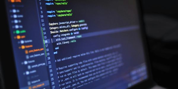 Computer screen displaying code in a development environment with Ruby on Rails framework.