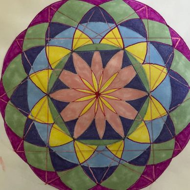 Colorful geometric mandala with floral center.