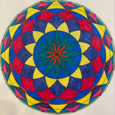 Colorful geometric mandala design on paper.