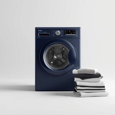 Modern dark blue front-loading washing machine with folded laundry beside it.