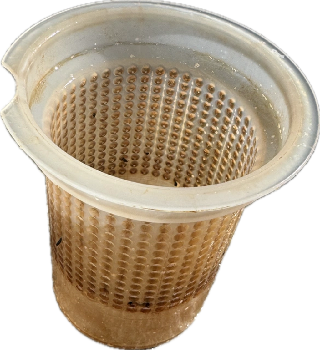 A vintage, perforated plastic basket with a wide rim and worn appearance.