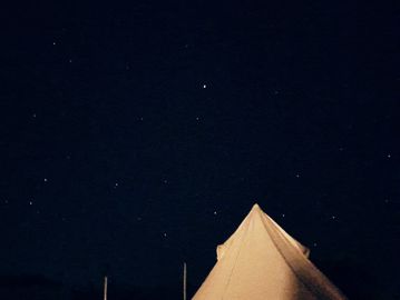 Bell tent under a starry sky