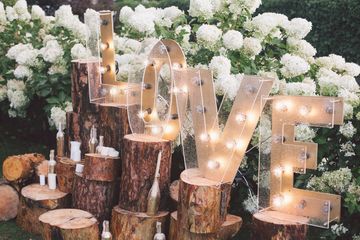 LOVE feature lights with white flowers in the background