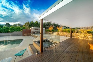 Merbau Decking, Granite Paving and Exposed Aggregate to pool Hut Area