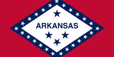 The Arkansas state flag with a diamond and stars on a red background.