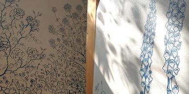 Wall art of detailed floral and plant designs.