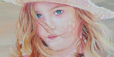 Portrait of a girl with blue eyes and a hat.