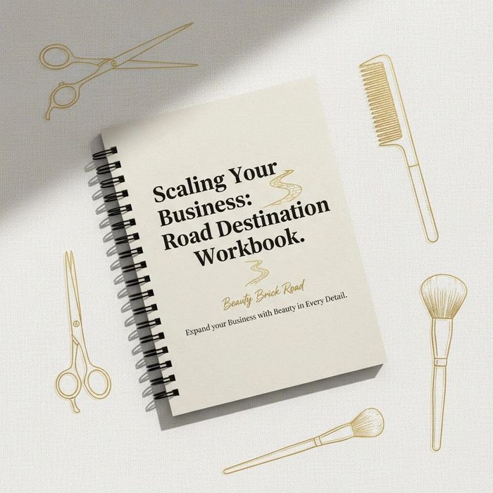 Workbook titled 'Scaling Your Business: Road Destination Workbook' surrounded by beauty tools.