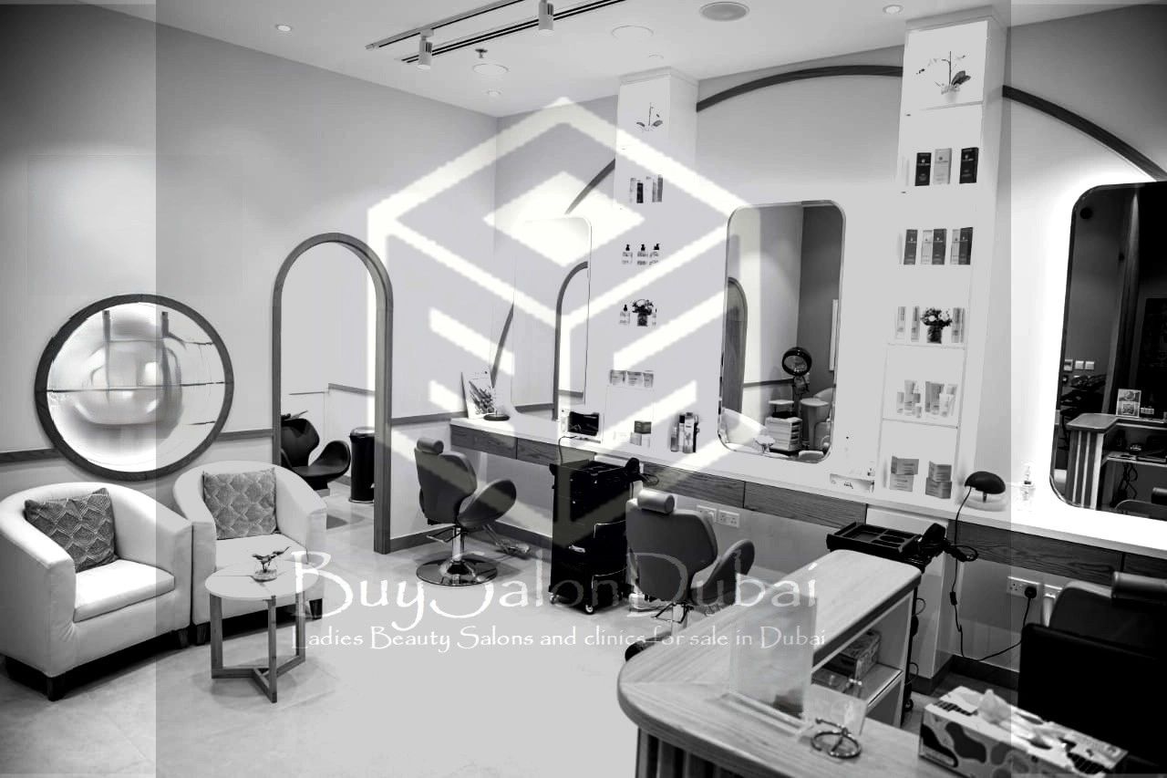 Modern beauty salon interior with stylish chairs and mirrors.
