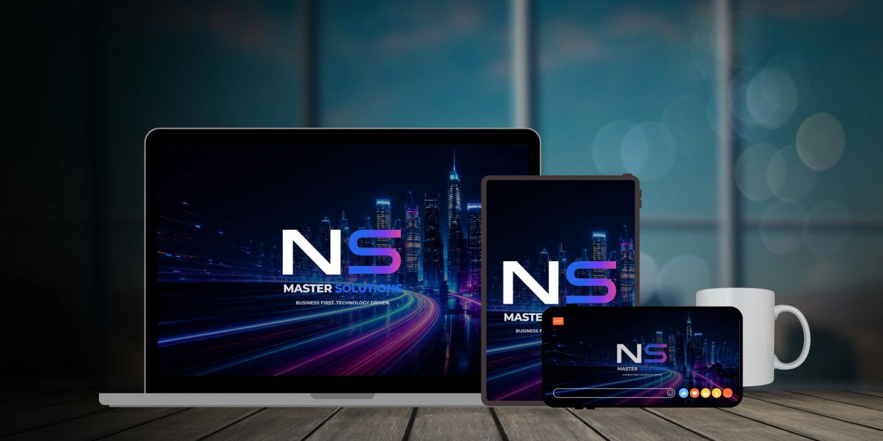 Digital devices displaying NS Master Solutions logo on a wooden table.