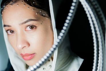 close-up of a beautiful model in an industrial setting