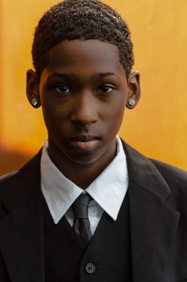 Headshot of young African man formally dressed 