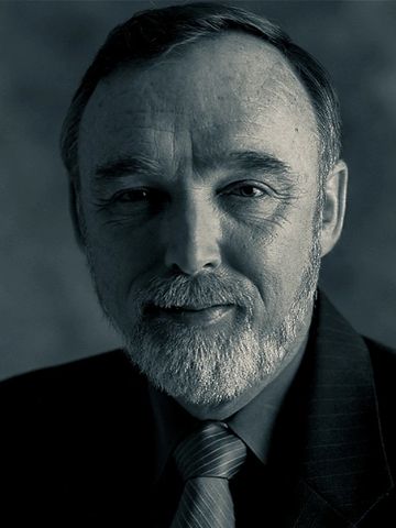 blue toned black  and white image of corporate executive