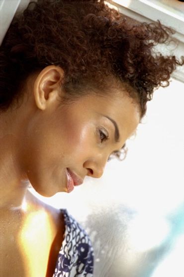 beautiful headshot of a model in front of the window