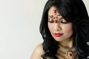 Beauty shot of a young Indian model wearing traditional jewelry and adornments 