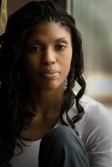  window lit head shot of a young African-American beauty model