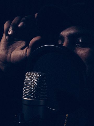 dramatic portrait of an urban artist in the recording studio