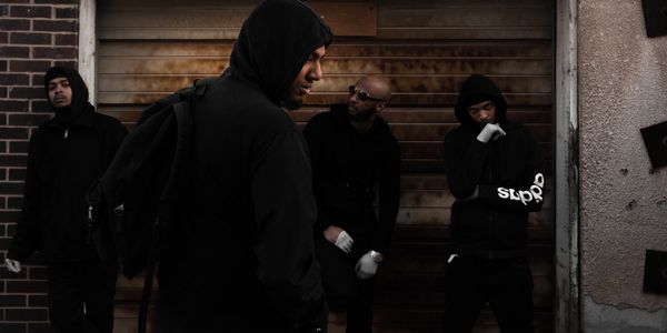 mysterious crew in a dimly lit alley