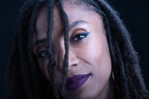 close-up beauty shot of beautiful model with purple lipstick