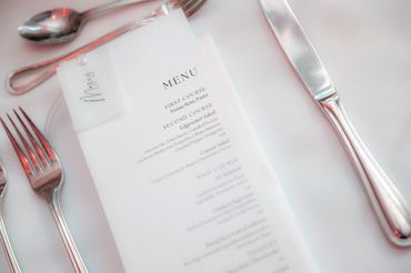detail image of the menu and table setting at the wedding reception