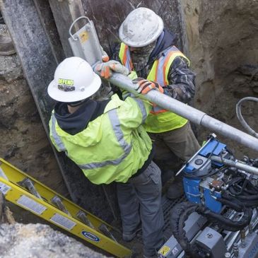 Water workers remove lead from pipes. Photo: Chicago Sun Times.