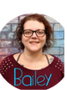 Portrait of a smiling woman with glasses.