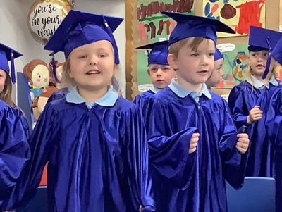 Children celebrating graduation