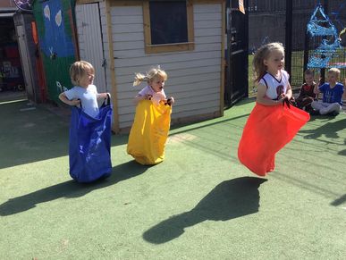 Children taking part in a sack race