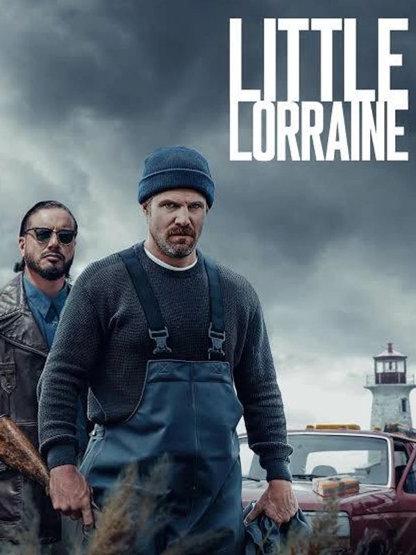 Two serious men stand in front of a lighthouse and a truck under stormy skies.