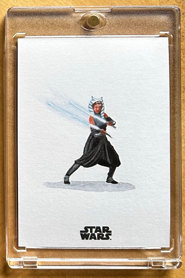 A Star Wars card featuring Ahsoka Tano with dual lightsabers ignited.
