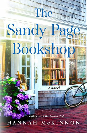 Cozy bookshop with flowers and a bicycle outside.