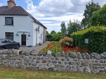Roadside view of house and garden