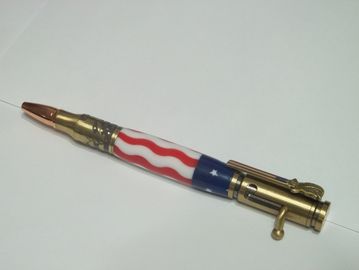 Bolt action salute america pen made with a resin flag barrel and finished in antique brass.