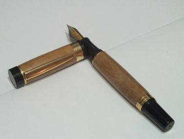 El Grande style fountain pen made with 24kt gold trim and fittings and having barrels made with an u