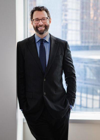 Image of Paul Cahill standing in the boardroom of his Toronto office.