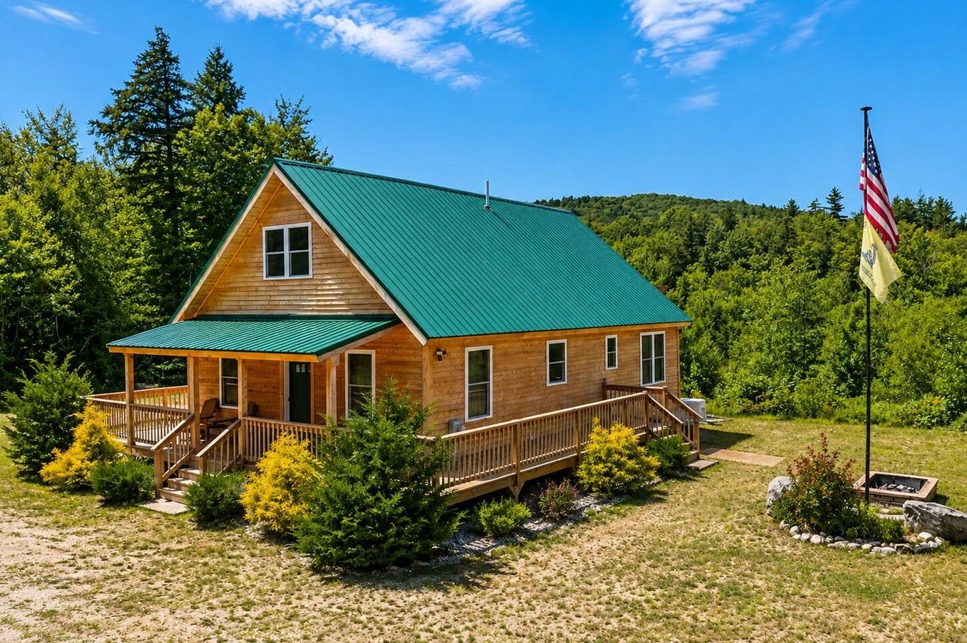 Wooden cabin with green roof in lush forest.