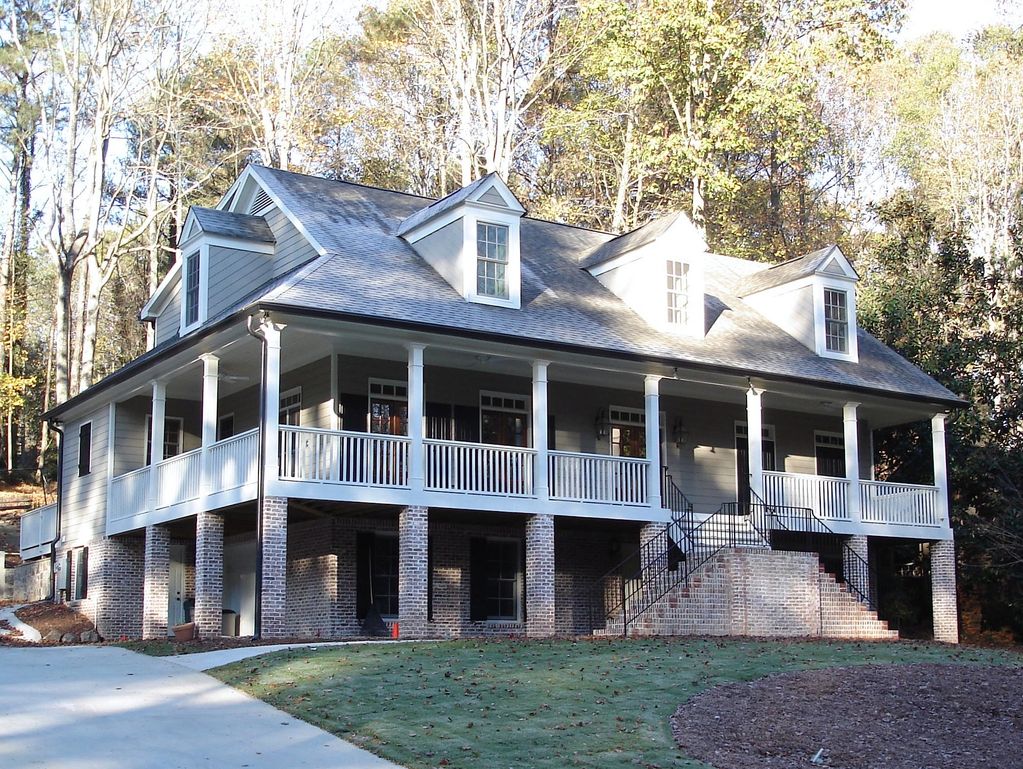 Renovation of an existing ranch with the addition of wrap around porches for a low-country look.
