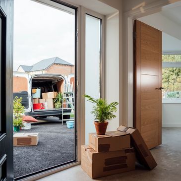 House with open door and boxes